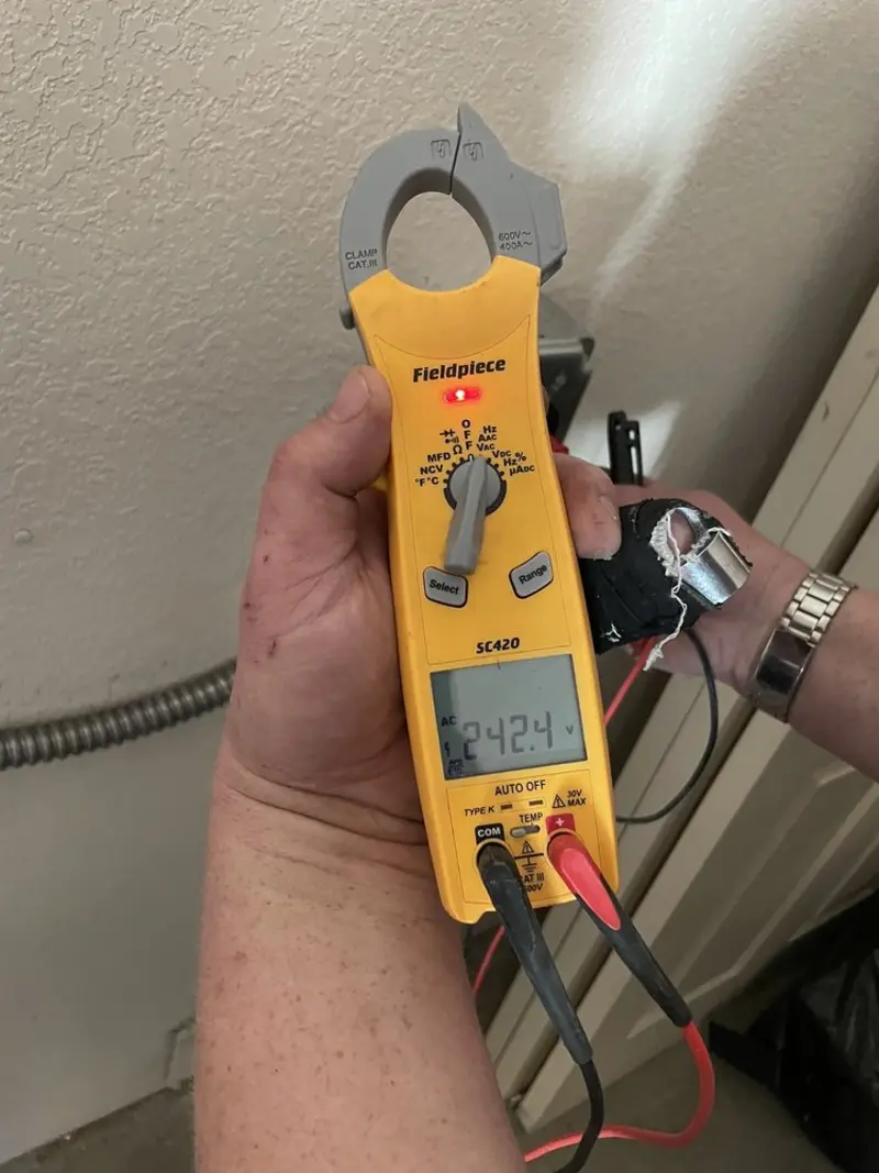 Voltage testing with clamp meter during Generator Installation in Williamsburg